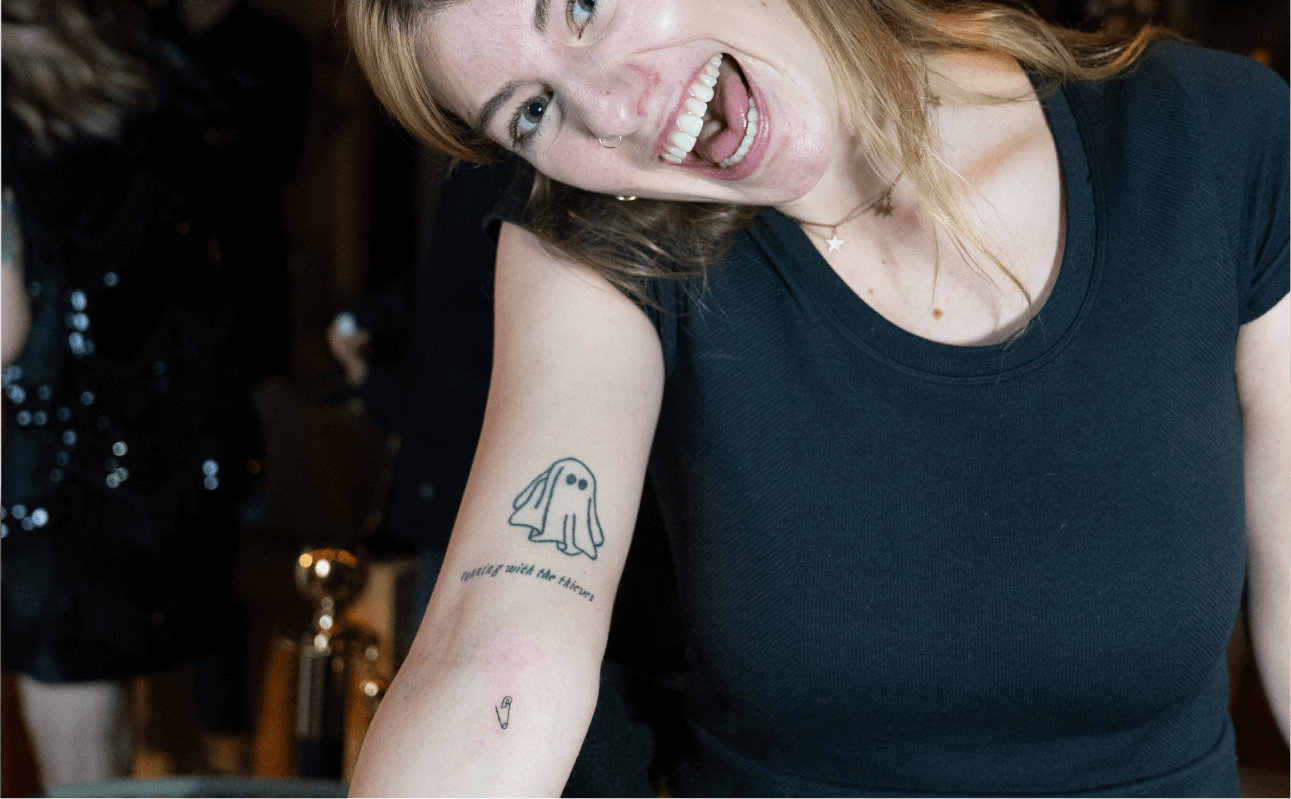 Tattoo enthusiasts getting unique designs inked at a live tattooing event, with talented artists creating memorable tattoos for each client